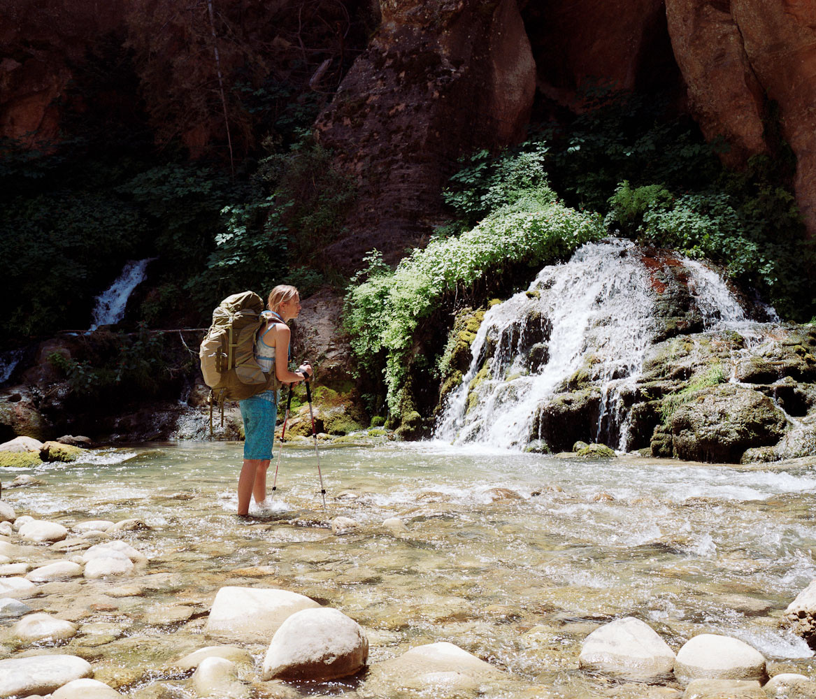 Emily Ayres at a waterfall in the Narrows in Zion National Park, Utah