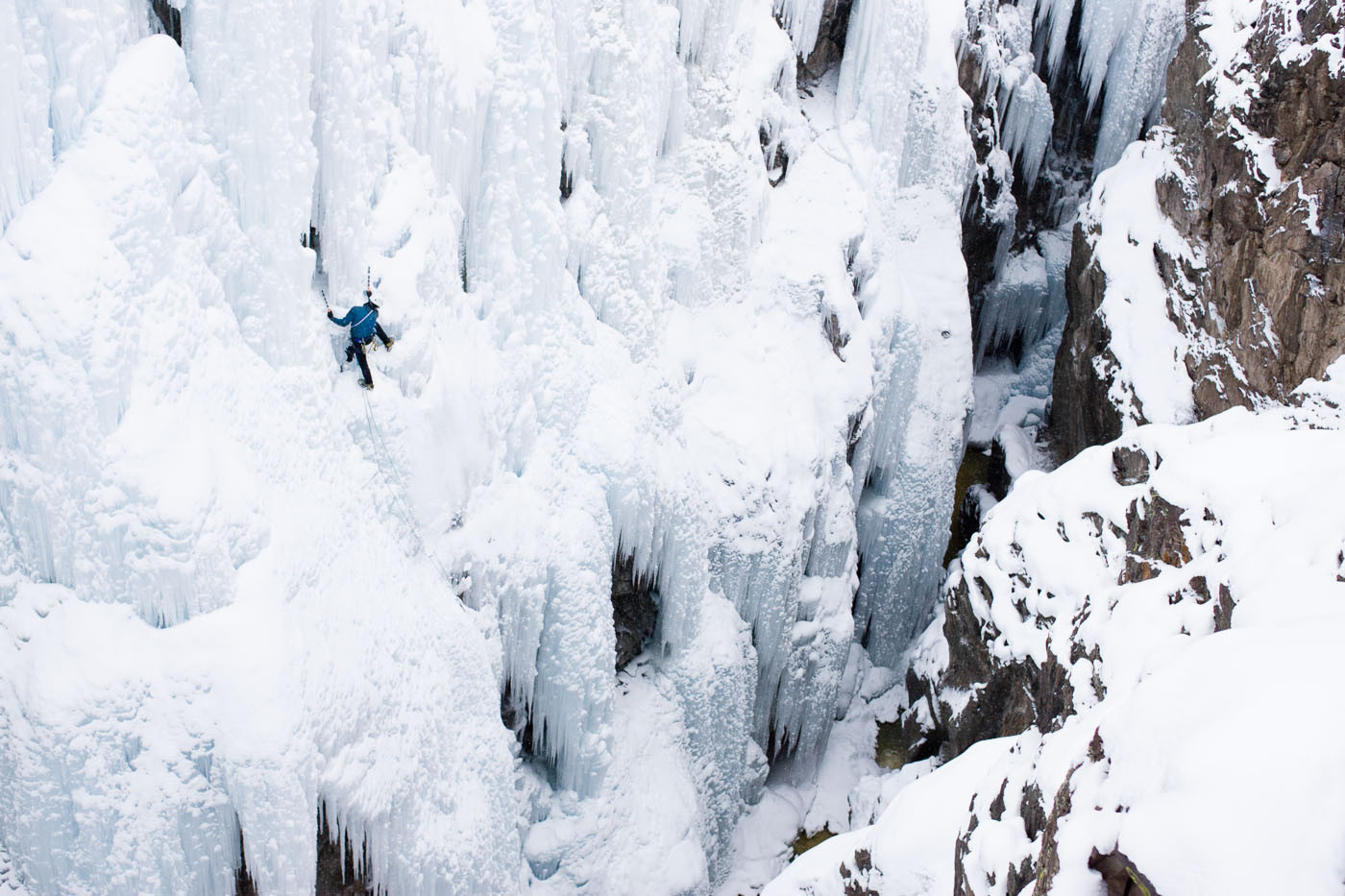 Male ice climber (Aaron Prochaska) climbing in Ouray, Colorado