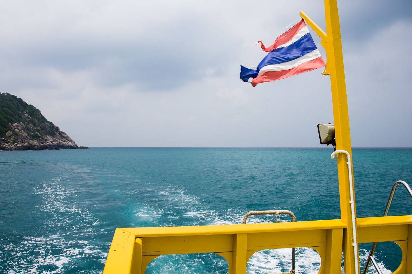 Stern of dive boat and flag near Koh Tao, Thailand