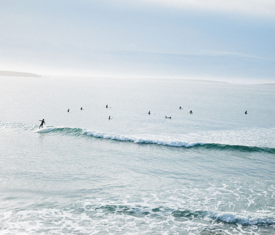 A lineup of surfers in Baja, Mexico